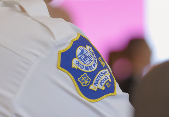 Close-up of the Waterbury Police Department shoulder patch on a white uniform