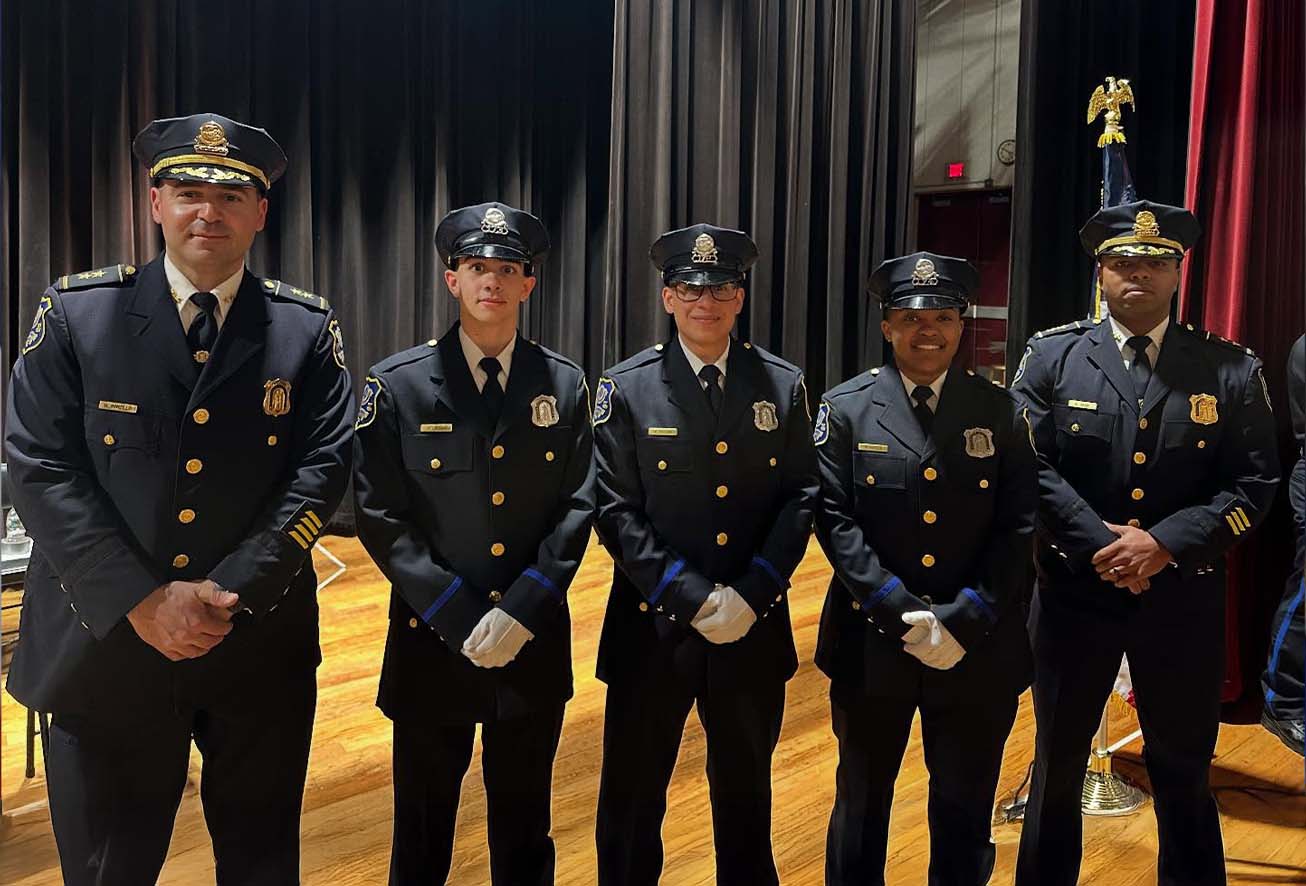 Five Waterbury Police officers in uniform standing together